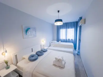 Cama o camas de una habitación en Lloret apartment & parking