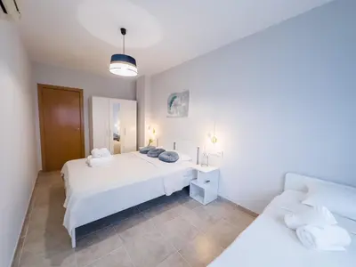 Cama o camas de una habitación en Lloret apartment & parking
