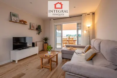Una televisión o centro de entretenimiento en InStyle Apartament Palamós