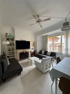 Una televisión o centro de entretenimiento en Apartamento con encanto a 2 minutos de la playa