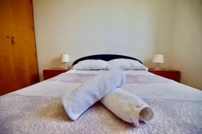 Cama o camas de una habitación en V&V LLORET- Villa Violetes