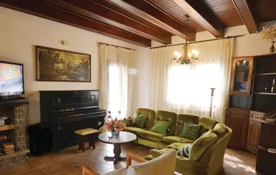 Zona de estar de Cozy Home In Palafolls