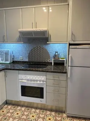 Una cocina o zona de cocina en Apartamento primera línea de mar en Platja d'aro