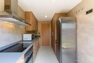 Una cocina o zona de cocina en PJS – Terraza, Piscina y Parking en Tossa