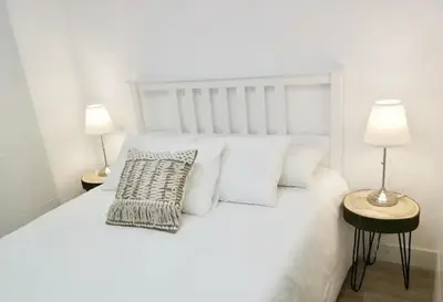 Cama o camas de una habitación en Moderno Loft a 2 minutos de la playa, en pleno centro histórico