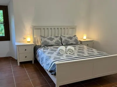 Cama o camas de una habitación en Casa Rural Can Ricós - El Mirador del Montseny