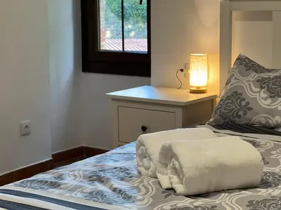 Cama o camas de una habitación en Casa Rural Can Ricós - El Mirador del Montseny