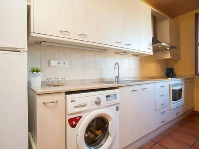 Una cocina o zona de cocina en El Atico de la Muralla en el Centro de Girona