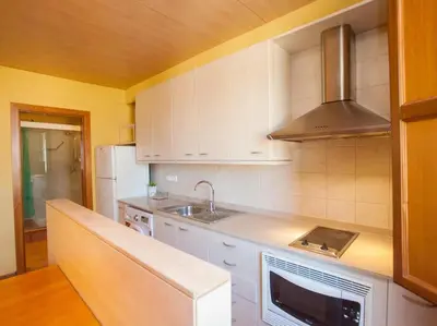 Una cocina o zona de cocina en El Atico de la Muralla en el Centro de Girona