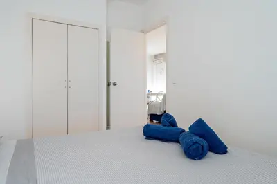 Cama o camas de una habitación en Hauzify I Apartament Apolo