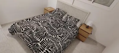 Cama o camas de una habitación en Apartamentos Baymar Playa de Aro