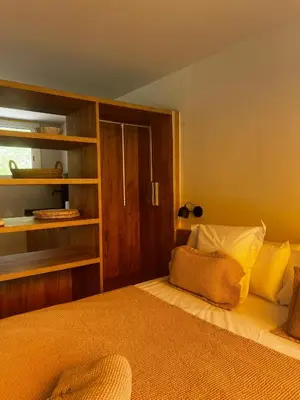 Cama o camas de una habitación en Apartament SUITES vista mar Sa Tuna