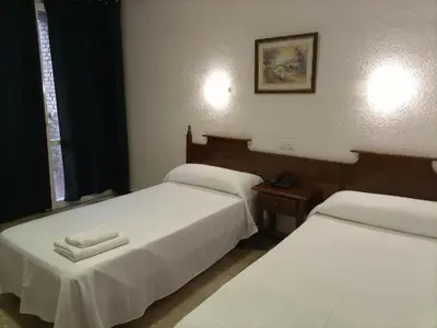 Cama o camas de una habitación en Vintage Hotel Mercedes