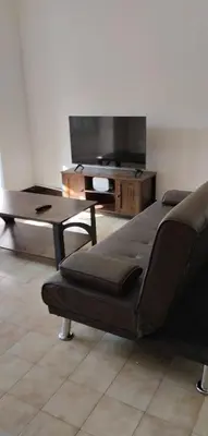 Una televisión o centro de entretenimiento en Casa céntrica en Girona