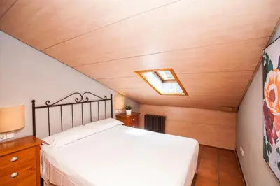 Cama o camas de una habitación en PELEGRÍ - ONYARAPARTMENT's COM