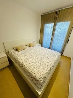Cama o camas de una habitación en Maravilloso piso de las playas Fenals y Sa Boadella