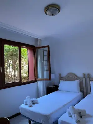 Cama o camas de una habitación en Amplia casa a 10 min de la playa