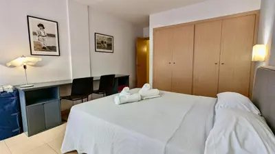 Cama o camas de una habitación en EVH-101 Apartamento en primera línea