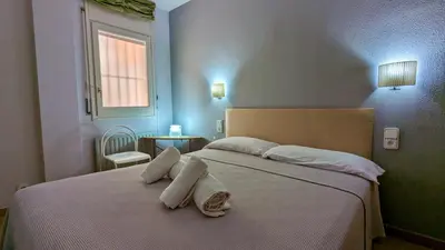 Cama o camas de una habitación en EVH-101 Apartamento en primera línea