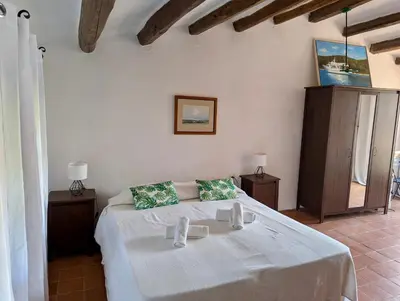 Cama o camas de una habitación en EVH-102 Casa dentro del castillo de Tossa de Mar