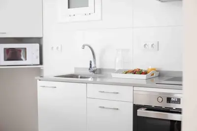 Una cocina o zona de cocina en CALMA HOME- Relájate y disfruta a 1 minuto del mar