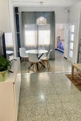 Una televisión o centro de entretenimiento en Acogedor apartamento
