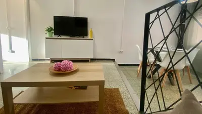 Una televisión o centro de entretenimiento en Acogedor apartamento