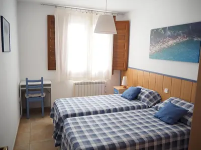 Cama o camas de una habitación en Apartamento grande a 3min playa