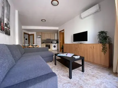 Una televisión o centro de entretenimiento en AL48 Apartment near leisure and beach Lloret
