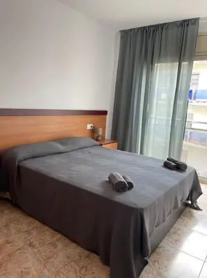 Cama o camas de una habitación en AL48 Apartment near leisure and beach Lloret