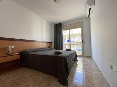 Cama o camas de una habitación en AL48 Apartment near leisure and beach Lloret