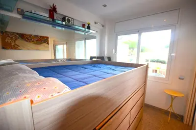 Cama o camas de una habitación en Apartamento frente a la playa Blanes Costa Brava