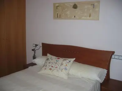 Cama o camas de una habitación en AMPLIO Y CONFORTABLE APARTAMENTO con PARKING