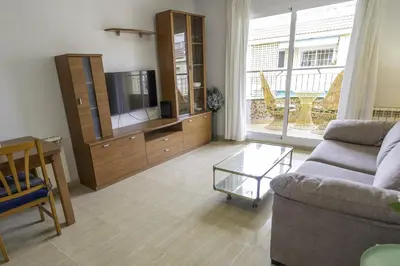 Una televisión o centro de entretenimiento en HomeHolidaysRentals Belisa - Costa Barcelona