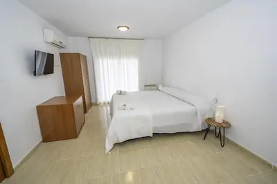 Cama o camas de una habitación en HomeHolidaysRentals Belisa - Costa Barcelona
