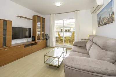 Una televisión o centro de entretenimiento en HomeHolidaysRentals Belisa - Costa Barcelona