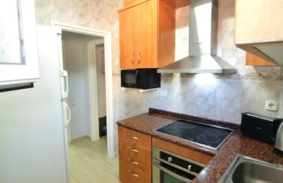 Una cocina o zona de cocina en HomeHolidaysRentals Blue - Costa Barcelona