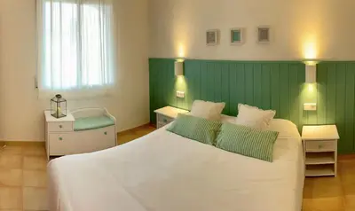 Cama o camas de una habitación en Nice house and pool by the golf course and close to the sea!