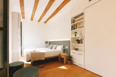 Cama o camas de una habitación en Bravissimo La Joia del Barri Vell