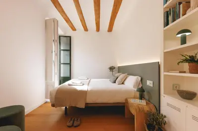 Cama o camas de una habitación en Bravissimo La Joia del Barri Vell