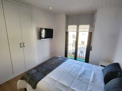 Cama o camas de una habitación en Apartamento a 100m de la playa