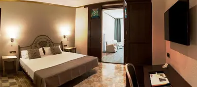 Cama o camas de una habitación en Hotel Diana