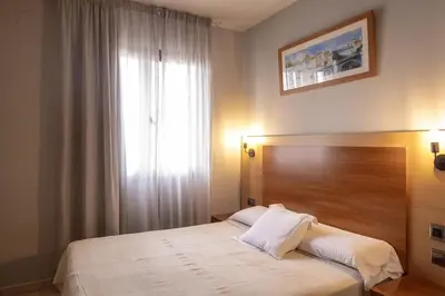 Cama o camas de una habitación en Hotel Sant Celoni