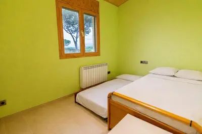 Cama o camas de una habitación en Spacious Countryside Costa Brava Relax
