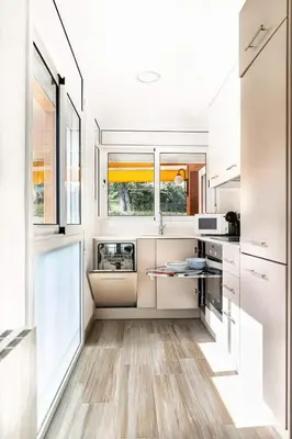 Una cocina o zona de cocina en Apartmento con piscina y pista de tennis