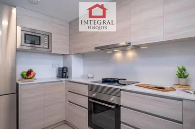 Una cocina o zona de cocina en El Coralí Apartament Palamós