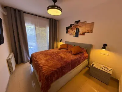 Cama o camas de una habitación en Lloret de Mar Coastal Retreat Just Steps from the Beach