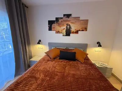 Cama o camas de una habitación en Lloret de Mar Coastal Retreat Just Steps from the Beach