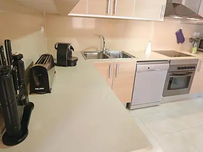 Una cocina o zona de cocina en Apartamento de vacaciones con terraza