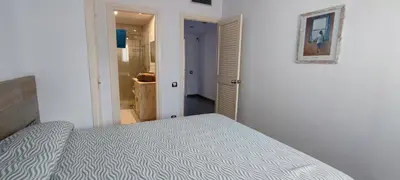 Cama o camas de una habitación en Lloguer 30 Grumet piscina y parquing